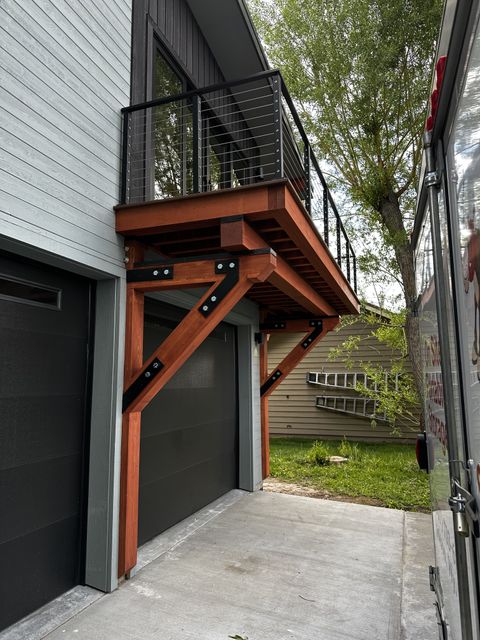 Side view of the timber-braced deck and garage door