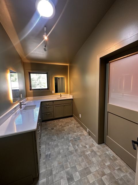 Vanity and tile floor in a bright bathroom